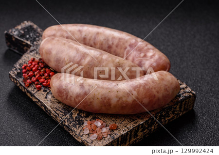Raw meat sausages made from beef or pork, fresh meat for barbecuing or grilling. Raw sausages Raw meat sausages made from beef or pork, fresh meat for barbecuing or grilling. Raw sausages 129992424