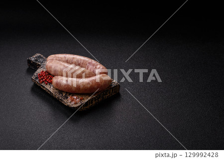 Raw meat sausages made from beef or pork, fresh meat for barbecuing or grilling. Raw sausages 129992428
