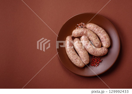 Raw meat sausages made from beef or pork, fresh meat for barbecuing or grilling. Raw sausages 129992433