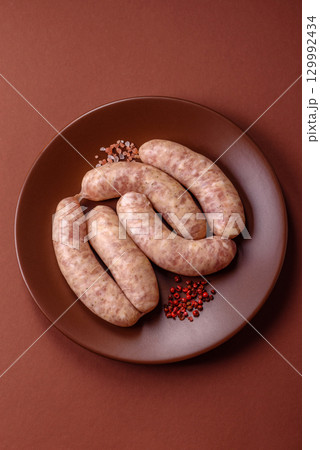 Raw meat sausages made from beef or pork, fresh meat for barbecuing or grilling. Raw sausages Raw meat sausages made from beef or pork, fresh meat for barbecuing or grilling. Raw sausages 129992434