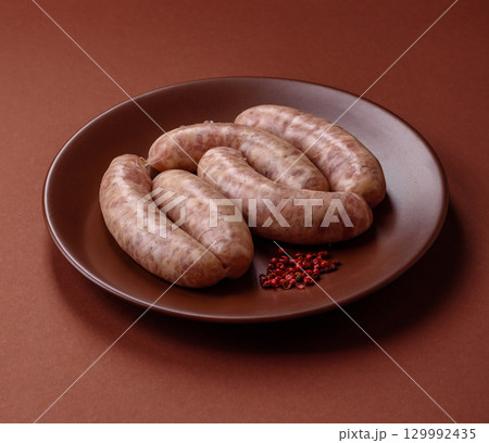 Raw meat sausages made from beef or pork, fresh meat for barbecuing or grilling. Raw sausages 129992435