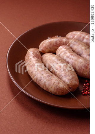 Raw meat sausages made from beef or pork, fresh meat for barbecuing or grilling. Raw sausages 129992439
