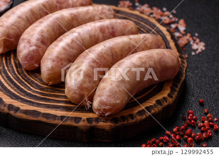 Raw meat sausages made from beef or pork, fresh meat for barbecuing or grilling. Raw sausages 129992455