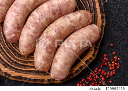 Raw meat sausages made from beef or pork, fresh meat for barbecuing or grilling. Raw sausages Raw meat sausages made from beef or pork, fresh meat for barbecuing or grilling. Raw sausages 129992456