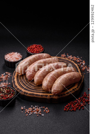Raw meat sausages made from beef or pork, fresh meat for barbecuing or grilling. Raw sausages Raw meat sausages made from beef or pork, fresh meat for barbecuing or grilling. Raw sausages 129992462