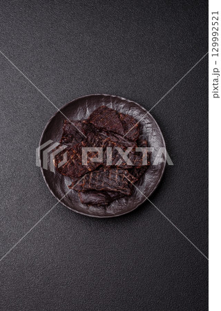 Snacks or jerky, beef slice meat dried, dehydrated. Beef snack Snacks or jerky, beef slice meat dried, dehydrated. Beef snack 129992521