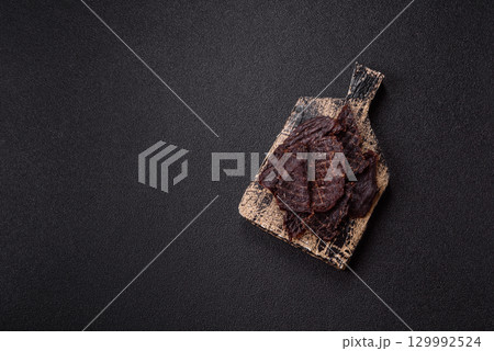 Snacks or jerky, beef slice meat dried, dehydrated. Beef snack Snacks or jerky, beef slice meat dried, dehydrated. Beef snack 129992524