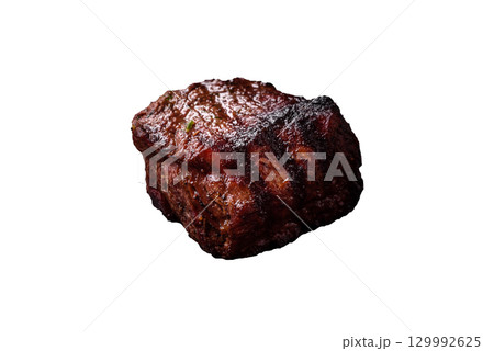 Grilled beef steak meat with salt and pepper. Beef steak grilled on a barbecue 129992625