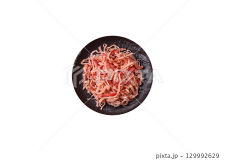 Food, dried squid in shavings or chopped as snacks or jerky. Snack dried squid for beer Food, dried squid in shavings or chopped as snacks or jerky. Snack dried squid for beer 129992629