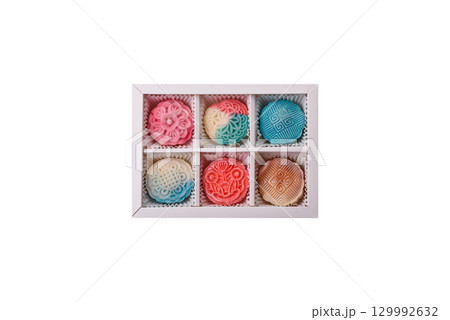 Chinese mooncake is an Asian sweet dessert. Asian mooncake as a background for your design Chinese mooncake is an Asian sweet dessert. Asian mooncake as a background for your design 129992632