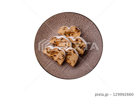 Christmas Stollen, a German sweet cake with marzipan and fruit. Winter Christmas Stollen 129992660