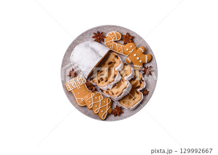 Christmas Stollen, a German sweet cake with marzipan and fruit. Winter Christmas Stollen 129992667