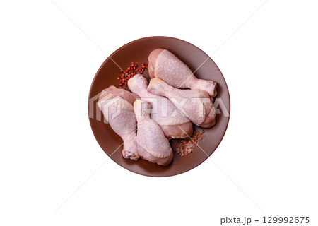Raw chicken legs, fresh uncooked poultry meat. Chicken or turkey legs Raw chicken legs, fresh uncooked poultry meat. Chicken or turkey legs 129992675