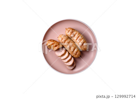 Grilled chicken or beef sausages, a hot meat dish. Barbecued sausages 129992714