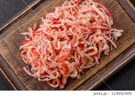 Food, dried squid in shavings or chopped as snacks or jerky. Snack dried squid for beer 129992909