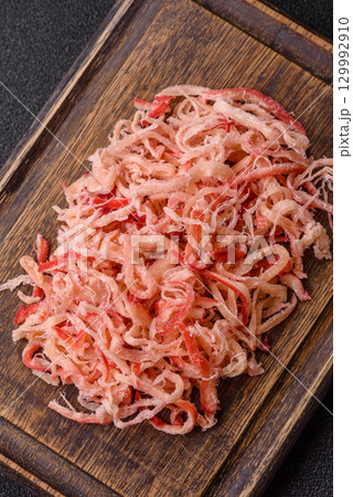 Food, dried squid in shavings or chopped as snacks or jerky. Snack dried squid for beer Food, dried squid in shavings or chopped as snacks or jerky. Snack dried squid for beer 129992910