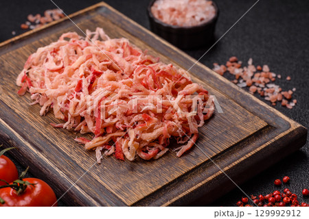 Food, dried squid in shavings or chopped as snacks or jerky. Snack dried squid for beer Food, dried squid in shavings or chopped as snacks or jerky. Snack dried squid for beer 129992912