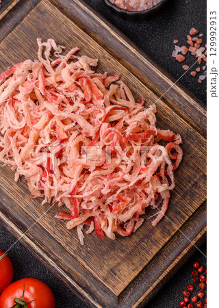 Food, dried squid in shavings or chopped as snacks or jerky. Snack dried squid for beer Food, dried squid in shavings or chopped as snacks or jerky. Snack dried squid for beer 129992913