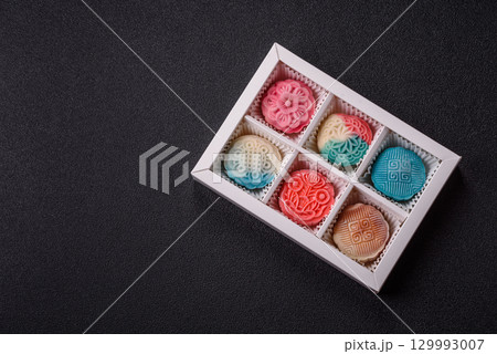 Chinese mooncake is an Asian sweet dessert. Asian mooncake as a background for your design 129993007
