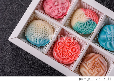 Chinese mooncake is an Asian sweet dessert. Asian mooncake as a background for your design Chinese mooncake is an Asian sweet dessert. Asian mooncake as a background for your design 129993011