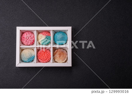 Chinese mooncake is an Asian sweet dessert. Asian mooncake as a background for your design 129993016