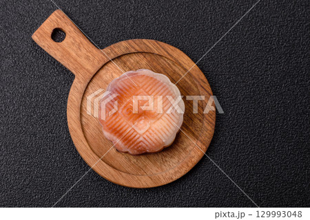 Chinese mooncake is an Asian sweet dessert. Asian mooncake as a background for your design 129993048