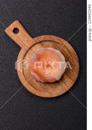 Chinese mooncake is an Asian sweet dessert. Asian mooncake as a background for your design Chinese mooncake is an Asian sweet dessert. Asian mooncake as a background for your design 129993049