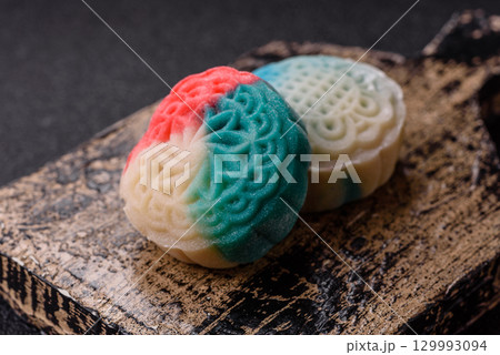 Chinese mooncake is an Asian sweet dessert. Asian mooncake as a background for your design Chinese mooncake is an Asian sweet dessert. Asian mooncake as a background for your design 129993094