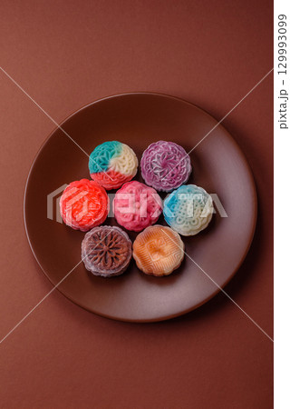 Chinese mooncake is an Asian sweet dessert. Asian mooncake as a background for your design Chinese mooncake is an Asian sweet dessert. Asian mooncake as a background for your design 129993099