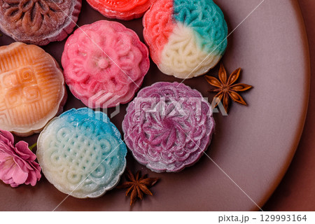 Chinese mooncake is an Asian sweet dessert. Asian mooncake as a background for your design 129993164