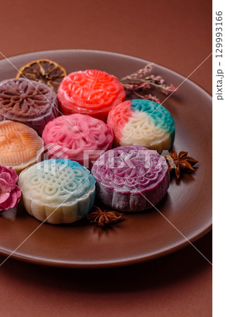 Chinese mooncake is an Asian sweet dessert. Asian mooncake as a background for your design Chinese mooncake is an Asian sweet dessert. Asian mooncake as a background for your design 129993166