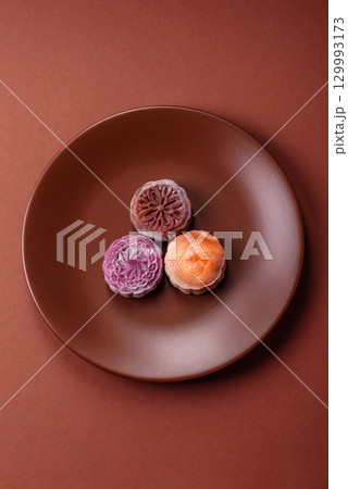 Chinese mooncake is an Asian sweet dessert. Asian mooncake as a background for your design 129993173