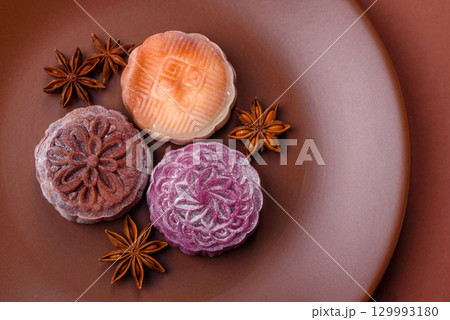Chinese mooncake is an Asian sweet dessert. Asian mooncake as a background for your design Chinese mooncake is an Asian sweet dessert. Asian mooncake as a background for your design 129993180