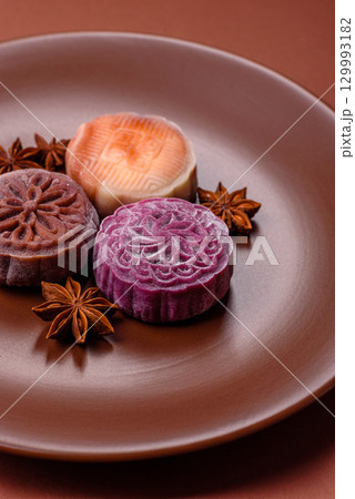 Chinese mooncake is an Asian sweet dessert. Asian mooncake as a background for your design 129993182