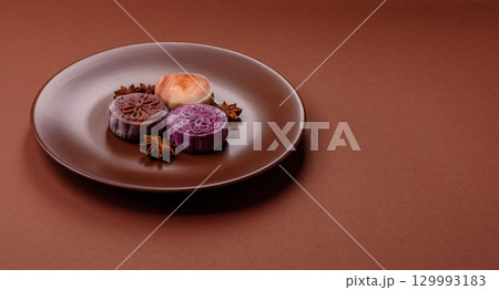 Chinese mooncake is an Asian sweet dessert. Asian mooncake as a background for your design 129993183