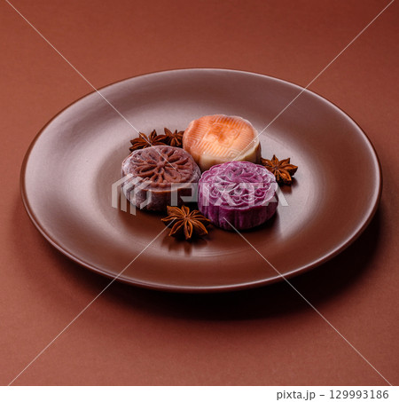 Chinese mooncake is an Asian sweet dessert. Asian mooncake as a background for your design Chinese mooncake is an Asian sweet dessert. Asian mooncake as a background for your design 129993186