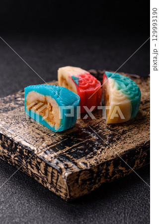 Chinese mooncake is an Asian sweet dessert. Asian mooncake as a background for your design 129993190