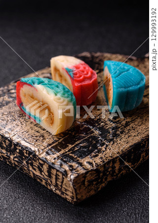 Chinese mooncake is an Asian sweet dessert. Asian mooncake as a background for your design Chinese mooncake is an Asian sweet dessert. Asian mooncake as a background for your design 129993192