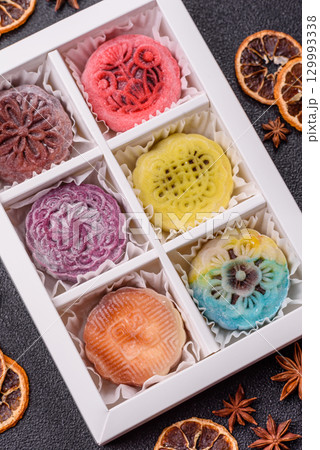 Chinese mooncake is an Asian sweet dessert. Asian mooncake as a background for your design 129993338