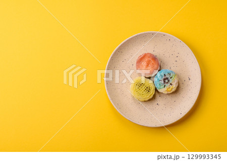 Chinese mooncake is an Asian sweet dessert. Asian mooncake as a background for your design Chinese mooncake is an Asian sweet dessert. Asian mooncake as a background for your design 129993345