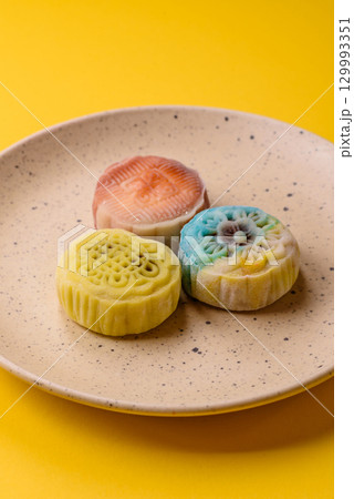 Chinese mooncake is an Asian sweet dessert. Asian mooncake as a background for your design 129993351