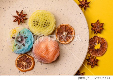 Chinese mooncake is an Asian sweet dessert. Asian mooncake as a background for your design Chinese mooncake is an Asian sweet dessert. Asian mooncake as a background for your design 129993353