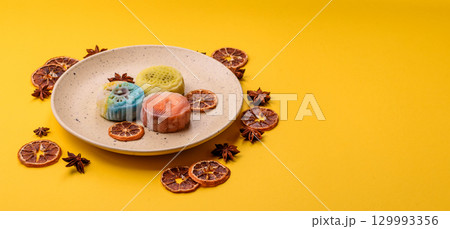 Chinese mooncake is an Asian sweet dessert. Asian mooncake as a background for your design 129993356