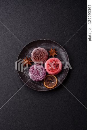 Chinese mooncake is an Asian sweet dessert. Asian mooncake as a background for your design 129993362