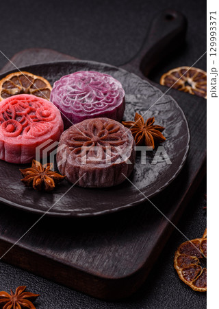 Chinese mooncake is an Asian sweet dessert. Asian mooncake as a background for your design 129993371