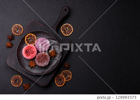 Chinese mooncake is an Asian sweet dessert. Asian mooncake as a background for your design Chinese mooncake is an Asian sweet dessert. Asian mooncake as a background for your design 129993373