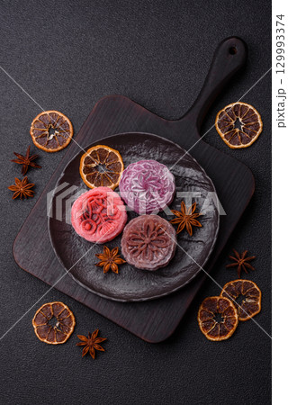 Chinese mooncake is an Asian sweet dessert. Asian mooncake as a background for your design Chinese mooncake is an Asian sweet dessert. Asian mooncake as a background for your design 129993374