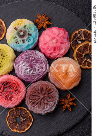 Chinese mooncake is an Asian sweet dessert. Asian mooncake as a background for your design Chinese mooncake is an Asian sweet dessert. Asian mooncake as a background for your design 129993386