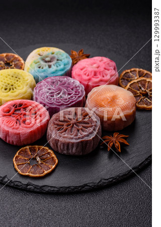 Chinese mooncake is an Asian sweet dessert. Asian mooncake as a background for your design Chinese mooncake is an Asian sweet dessert. Asian mooncake as a background for your design 129993387