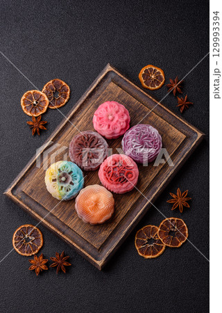 Chinese mooncake is an Asian sweet dessert. Asian mooncake as a background for your design 129993394